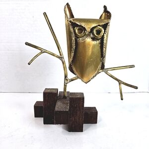 Brass owl on a branch metal sculpture. Wood base stamped CJ_